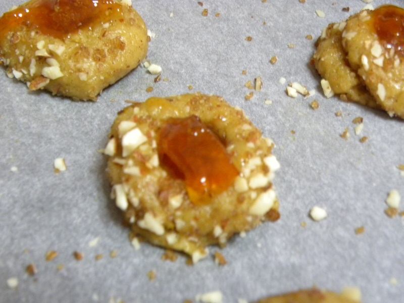 Adding the marmalade to the thumbprint cookies image