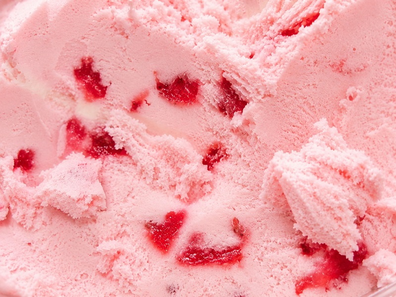 strawberry ice cream showing the strawberry sauce inside image